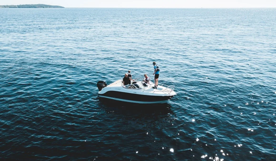 three person on white motorboat at daytime